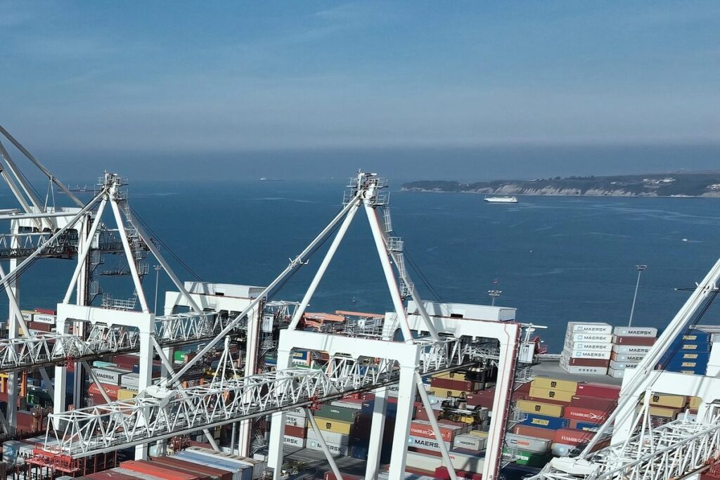 Container cranes and stacked containers at a port terminal