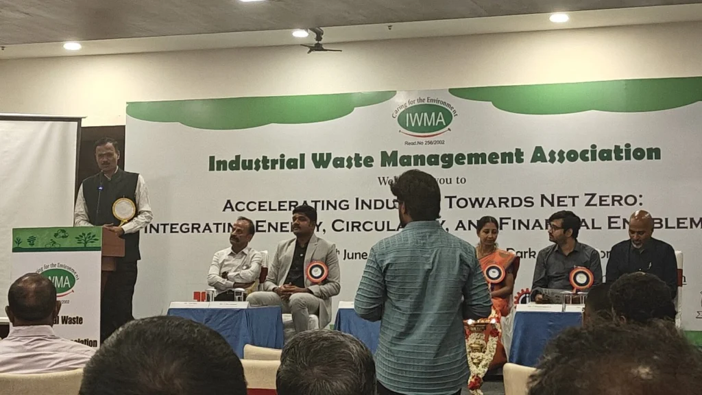 A speaker at the IWMA lectern at the net zero seminar in Coimbatore, 12 June 2026